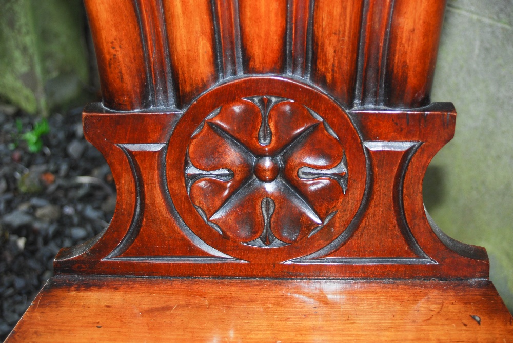 A pair of 19th century mahogany fan back hall chairs, the fan shaped backs carved with floral - Image 6 of 7