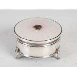 An early 20th century white metal and enamel circular shaped dressing table box, the hinged cover