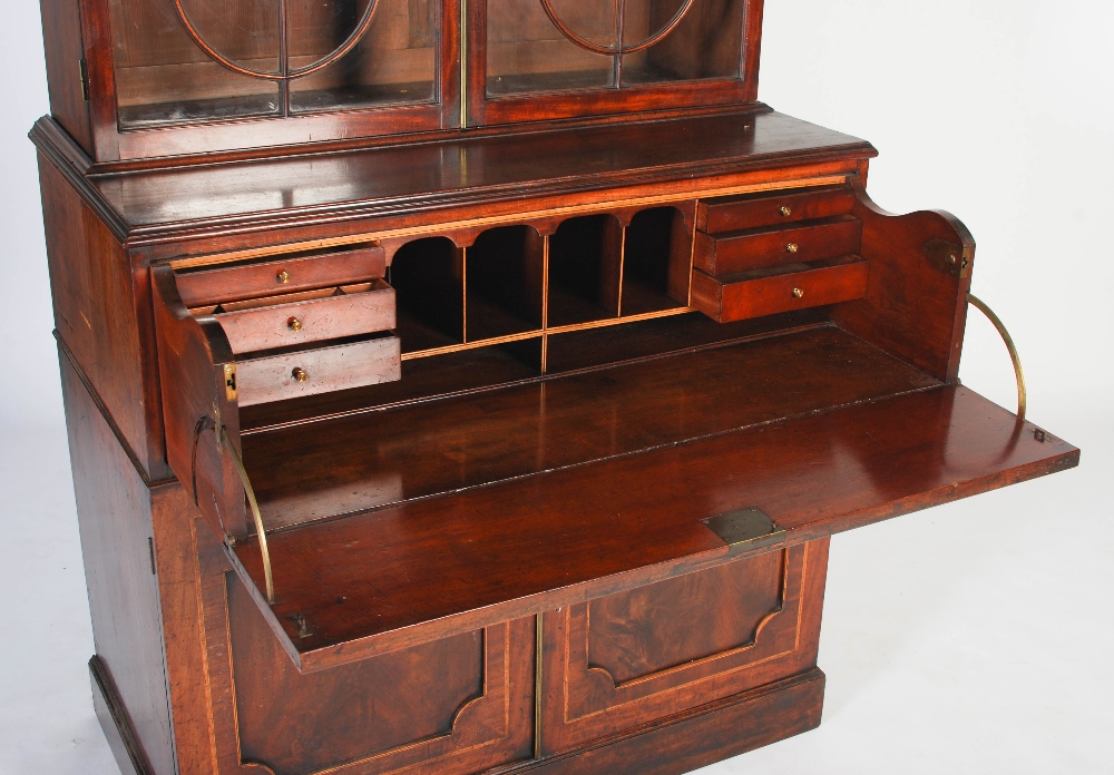 A George III mahogany and boxwood lined secretaire bookcase, the arched cornice centred with a - Image 7 of 9