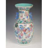 A Chinese porcelain famille rose Canton vase, Qing Dynasty, decorated with rectangular shaped panels