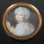 A late 19th century portrait miniature, depicting half length portrait of a young girl wearing night