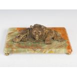 A late 19th century bronze and onyx inkwell in the form of a bear, the rectangular onyx base set