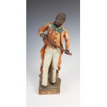 A late 19th/early 20th century cold painted terracotta figure group of a musician, 39.5cm high.
