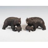 A pair of 19th century Black Forest carved wood bear and cub figures, with inlaid eyes and teeth,