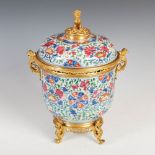 A Chinese porcelain famille rose ormolu mounted bowl and cover, Qing Dynasty, decorated with