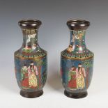 A pair of Chinese bronze cloisonne decorated vases, late 19th/early 20th century, decorated with