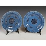 A pair of Chinese porcelain blue ground dishes, Qing Dynasty bearing Qianlong seal mark, but