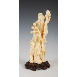 A Japanese ivory okimono of scholar, egret and boy, Meiji Period, signed on carved wood stand, 21.