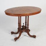 A Victorian burr walnut and marquetry centre table, the oval top inlaid with a scrolling lozenge