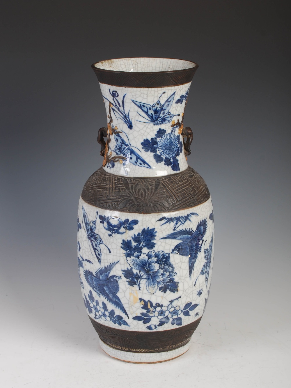 A Chinese porcelain blue and white crackle glazed vase, Qing Dynasty, decorated with foliate sprays,