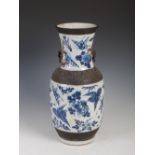 A Chinese porcelain blue and white crackle glazed vase, Qing Dynasty, decorated with foliate sprays,