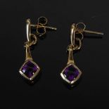 PRISM DESIGN, A pair of 9 carat yellow gold and amethyst cabochon lozenge-shaped drop earrings,