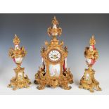 A late 19th century French gilt metal and porcelain mounted clock garniture, the clock with circular