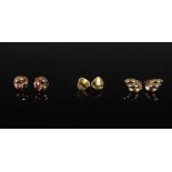 Three pairs of 9 carat gold earrings, comprising: a pair of 9 carat two-colour gold fluted earrings,