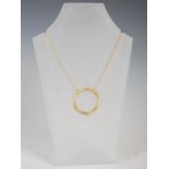 CURTEIS, An 18 carat yellow gold pendant necklace, formed as three entwined hoops, with six randomly