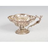 A 18th/19th century Dutch white metal libation cup of quatrefoil form, the interior decorated with