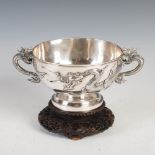 An impressive Chinese silver twin handled dragon bowl, late Qing Dynasty, signed Cheongshing, the