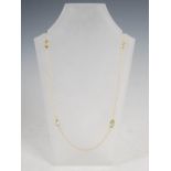 LAUREL JEWELLERY, A 9 carat yellow gold necklace, with six faceted oval peridot spacers, Stamped: