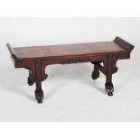 A Chinese dark wood Kang table, Qing Dynasty, the rectangular top with three burr wood panels, above