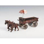 An early 20th century novelty cast metal and cold painted fresh fruit and vegetable horse and cart