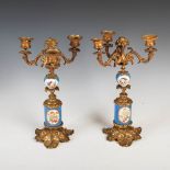 A pair of late 19th century French blue ground porcelain and gilt metal three light candelabra, with