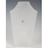 LAUREL JEWELLERY, A 9 carat two-colour gold and diamond pendant, set with eight diamonds on