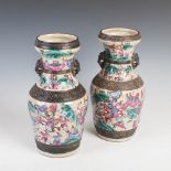A pair of Chinese porcelain famille rose crackle glazed vases, Qing Dynasty, decorated with warriors