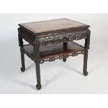 A Chinese dark wood centre table, Qing Dynasty, the rectangular top with mottled red and white