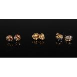 Three pairs of 9 carat gold earrings, comprising: a pair of 9 carat two-colour gold fluted earrings,