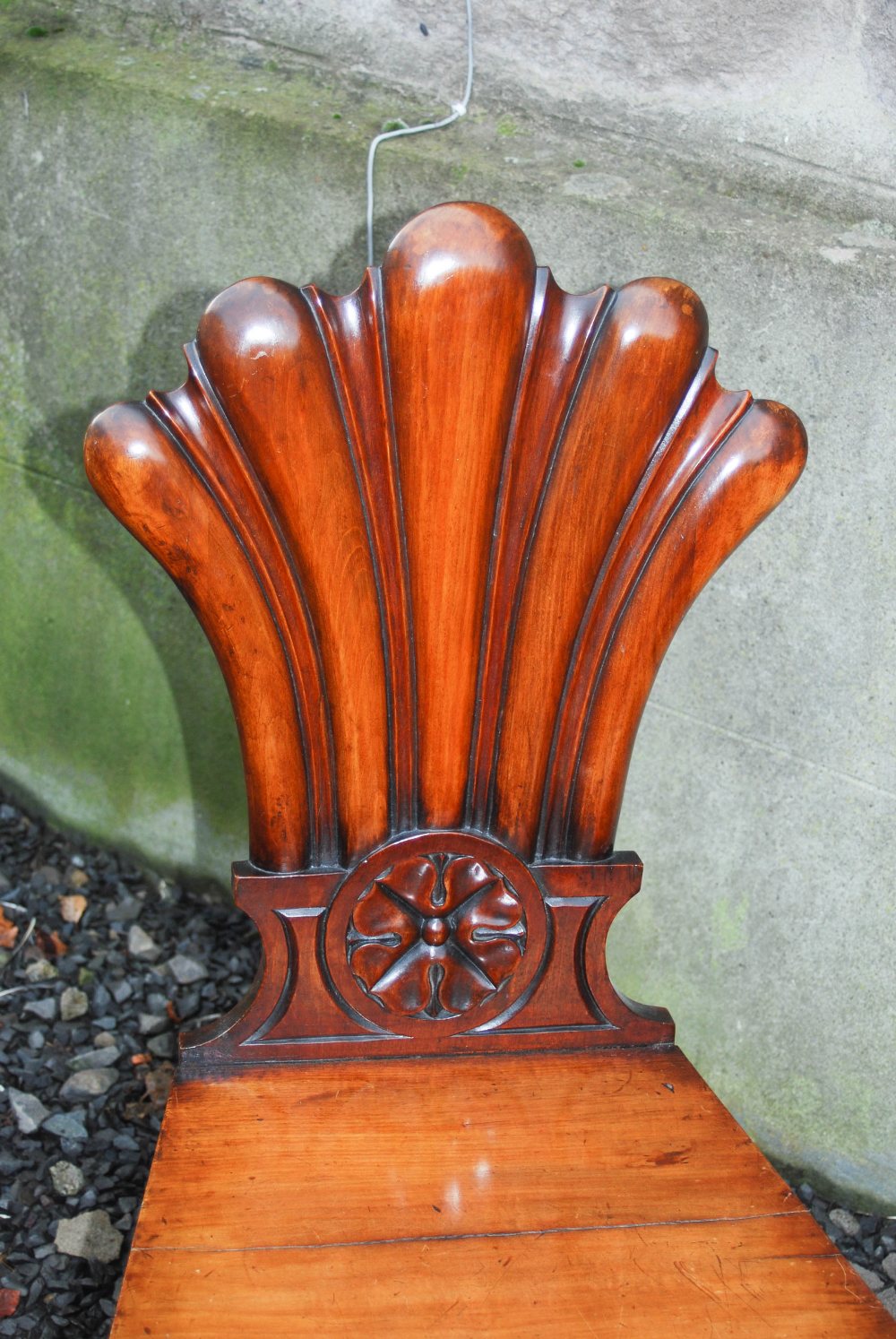 A pair of 19th century mahogany fan back hall chairs, the fan shaped backs carved with floral - Image 5 of 7