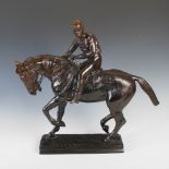 A late 19th/early 20th century bronze figure group of jockey on horseback, on rectangular plinth