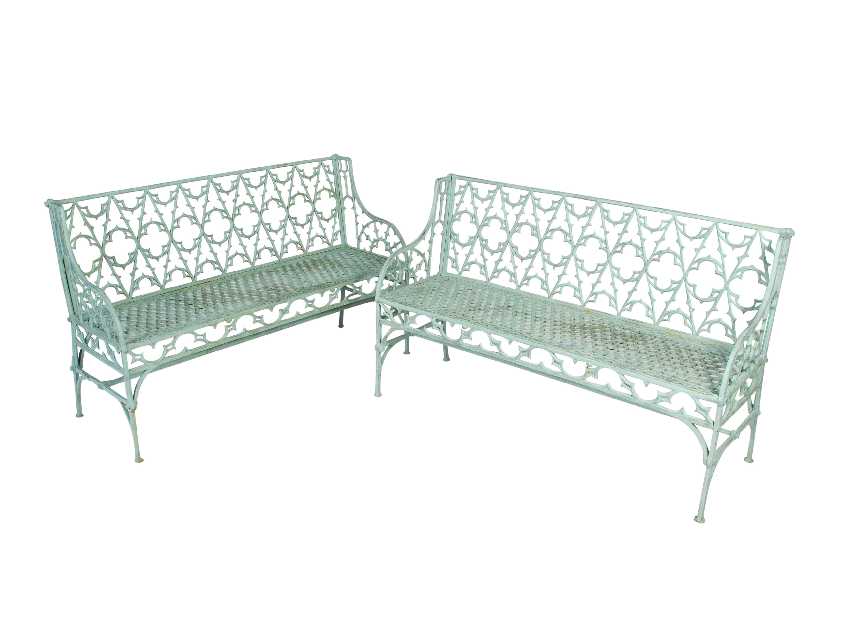 A near pair of 19th century cast iron Gothic Revival garden seats, after a design by James Yates,