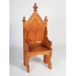 An early 20th century oak Gothic altar chair, the triangular panelled back centred with a relief