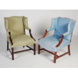 A pair of George III style mahogany Gainsborough wing armchairs, the upholstered backs, arms and