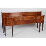 A George III Scottish mahogany and ebony lined sideboard, the upright stage back with two sliding