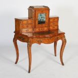 A Victorian walnut, marquetry and gilt metal mounted bonheur du jour, the upright back with mirrored