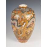 A Japanese Satsuma pottery vase, Meiji Period, decorated with lohan and dragons, the details