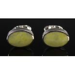 A pair of silver oval cufflinks, each set with Isle of Iona marble, Stamped: CK, 925 and Edinburgh