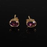 HERBERT MARX, A pair of 9 carat yellow gold faceted oval amethyst earrings, Stamped: HM Ld, 375.