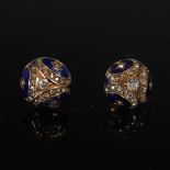 A pair of 19th century yellow metal, enamel and diamond button style earrings, each centred with