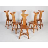 Beaverman - A set of six oak dining chairs, the rectangular top rails with pierced cut out above a