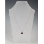 GRAHAM WILLIAMS, A 9 carat white gold, amethyst and diamond pendant, set with a square cushion,