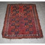 Three Persian rugs, late 19th/early 20th century, to include: a madder ground rectangular rug