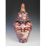 A Japanese Imari porcelain octagonal shaped jar and cover, Meiji Period, the tapered jar decorated