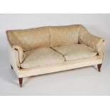 A late 19th/early 20th century mahogany sofa by Howard & Sons, the upholstered back, arms and