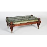 A William IV mahogany centre stool, with green button down leather upholstered cushion, raised on