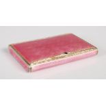 An early 20th century Continental silver gilt and pink enamel cigarette box, import marks for