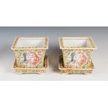 A pair of Chinese porcelain yellow ground jardinieres and stands, Qing Dynasty bearing six character