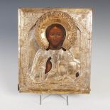 A Russian icon of St. Nicholas, Tempera on pine panel with pierced and embossed silvered yellow