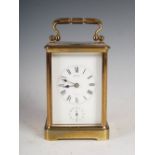 A late 19th century brass carriage clock, Hawley, Paris, the white enamelled dial with Roman